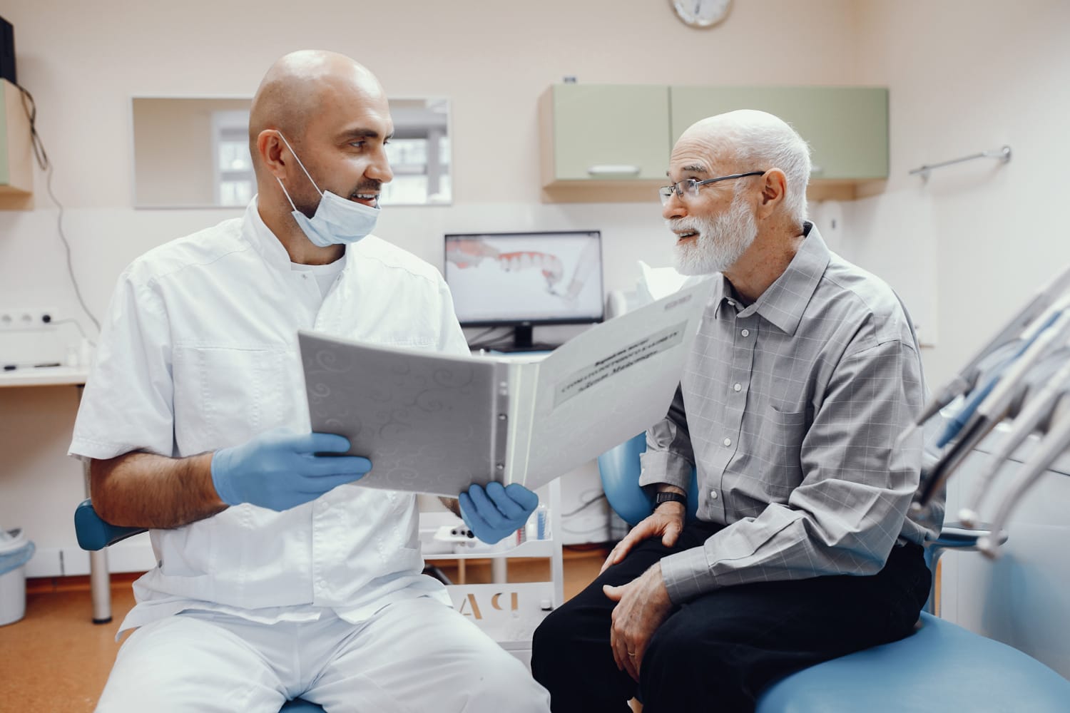 Old man sitting in the dentist's office