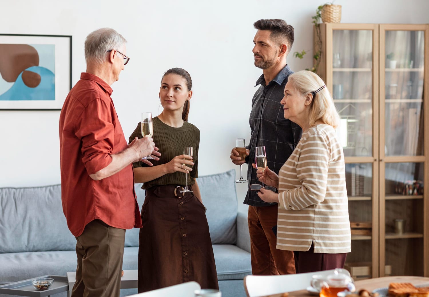 Medium shot happy family holding glasses