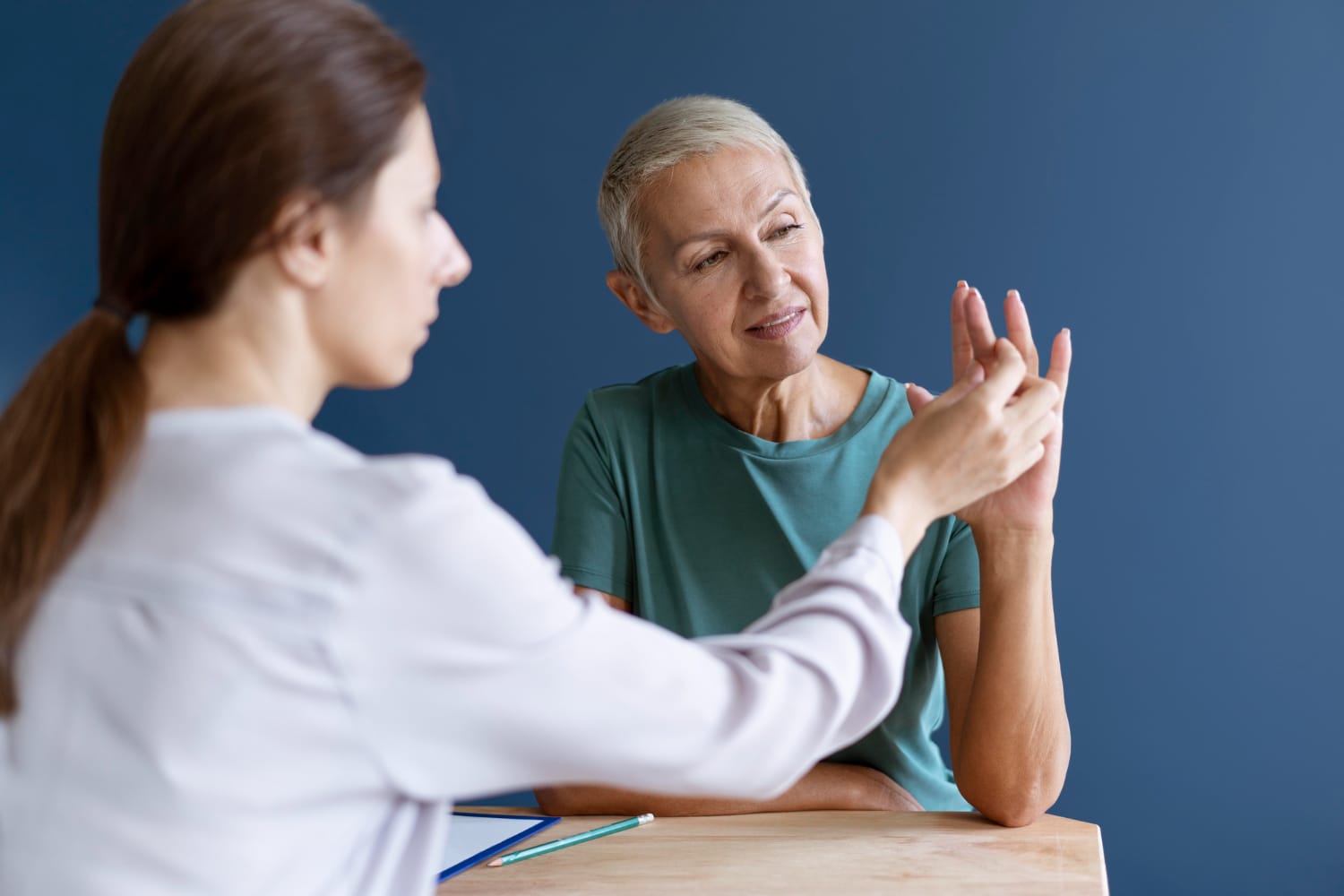 Older woman doing an occupational therapy session with a therapist.