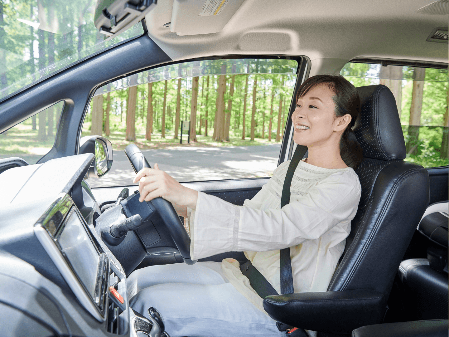 Adult woman driving car