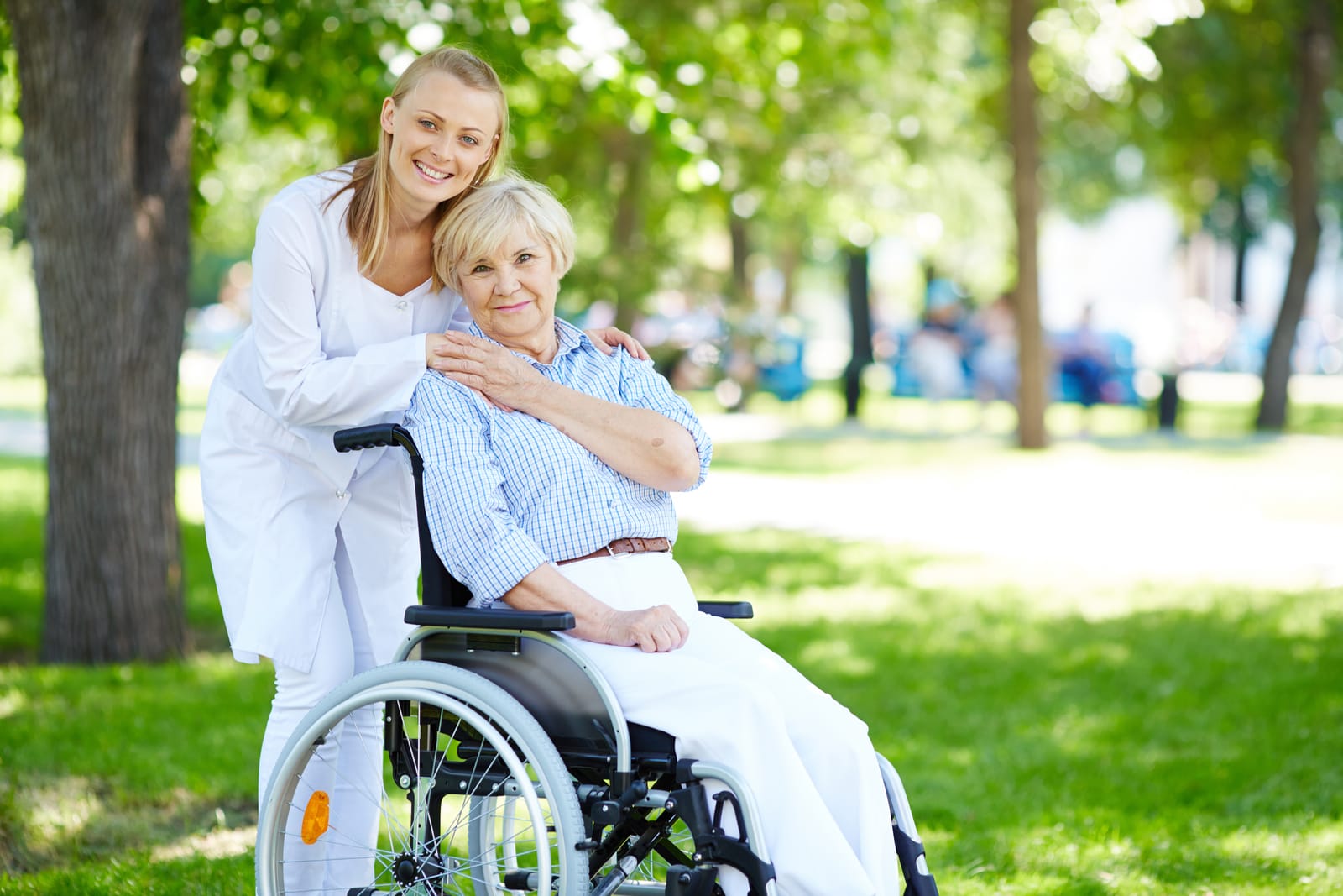 A caregiver and resident enjoying time together outdoors
